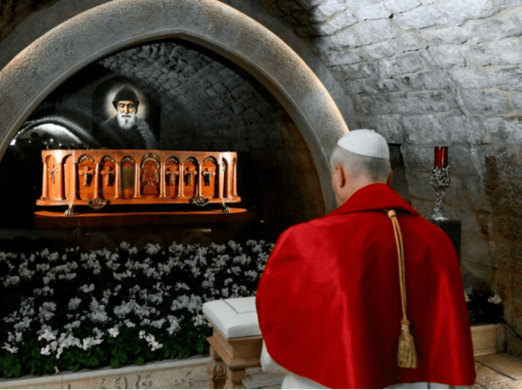 Pope Leo XIV praying at the tomb of the Lebanese monk Saint Charbel Makhlouf.
